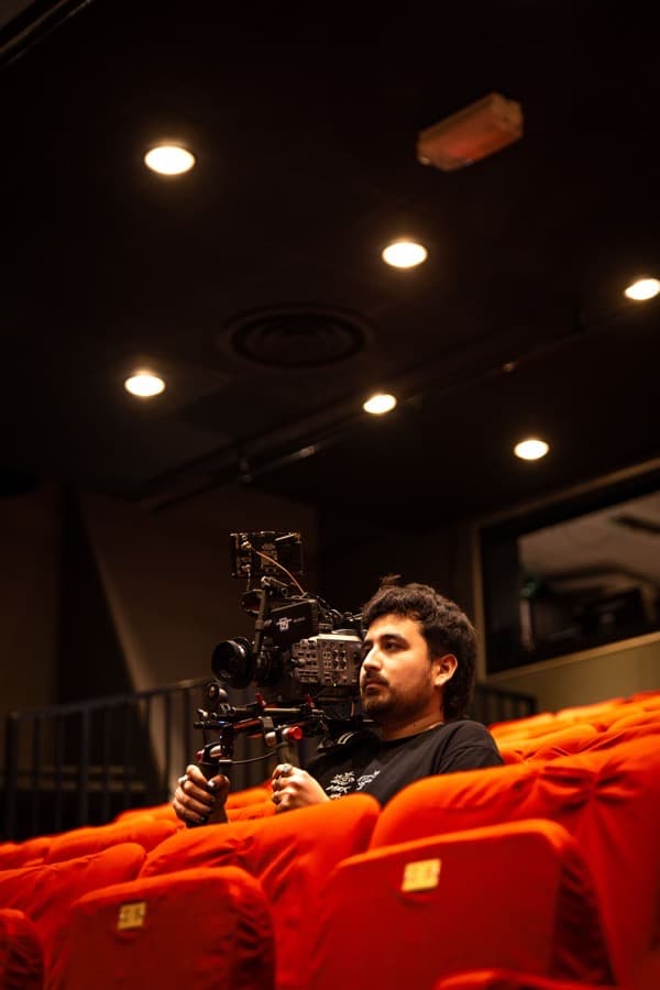 Rodrigo Chávez holding a Sony cinema camera on set